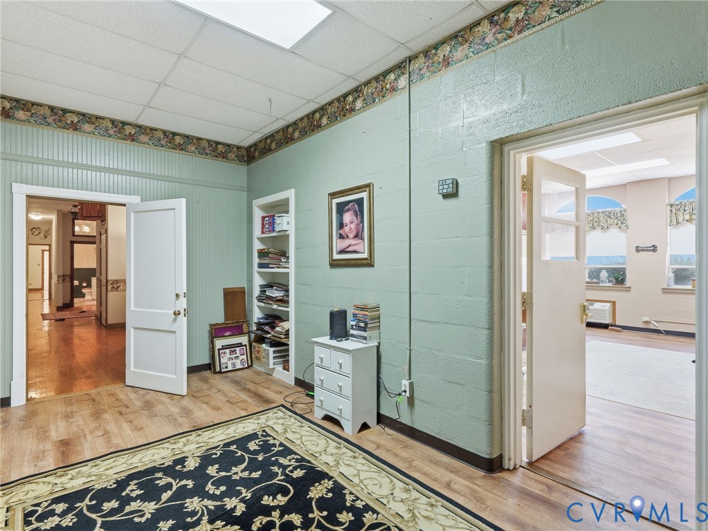 11152 Cross County Road Mineral, VA 23117 - Photo 3 of 29 a room with lots of wooden furniture and mirrors