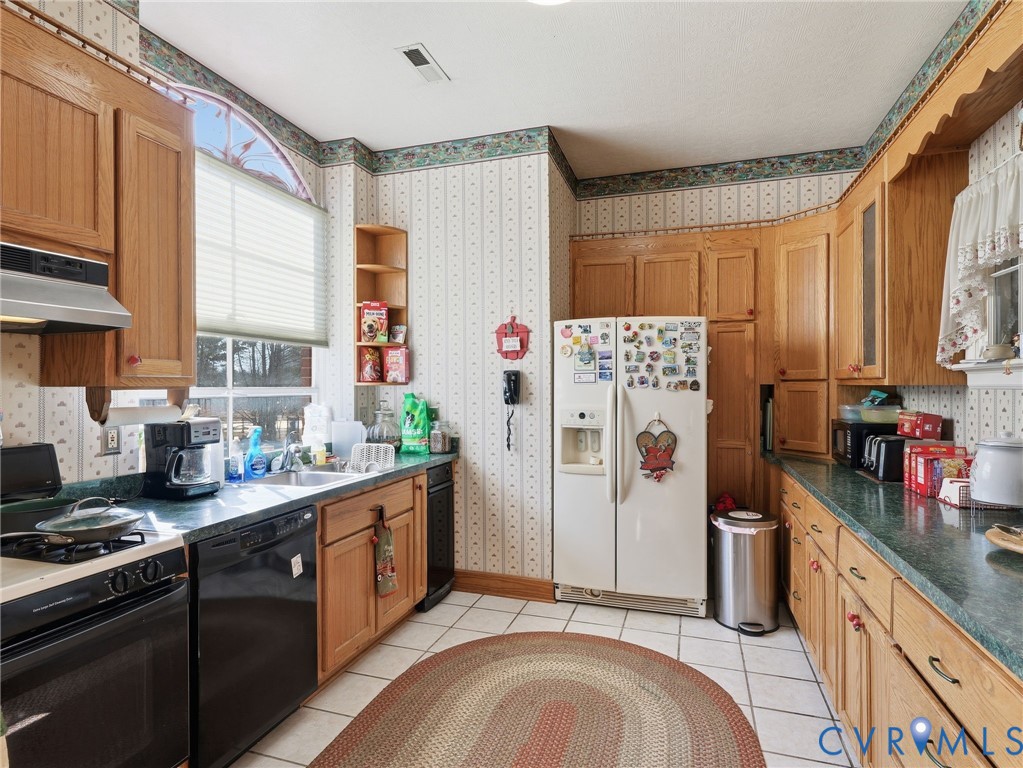 11152 Cross County Road Mineral, VA 23117 - Photo 4 of 29 a kitchen with stainless steel appliances granite countertop a refrigerator sink and stove