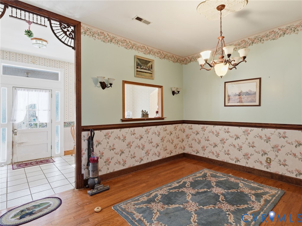 11152 Cross County Road Mineral, VA 23117 - Photo 8 of 29 a view of a hallway with a window and chandelier