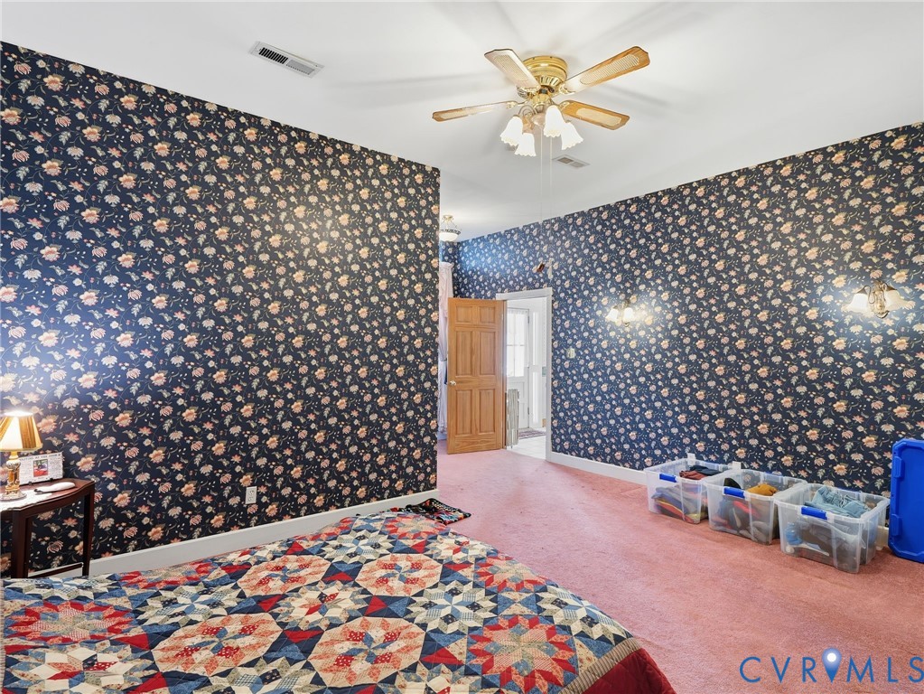 11152 Cross County Road Mineral, VA 23117 - Photo 10 of 29 a bedroom with a bed and a wall painting