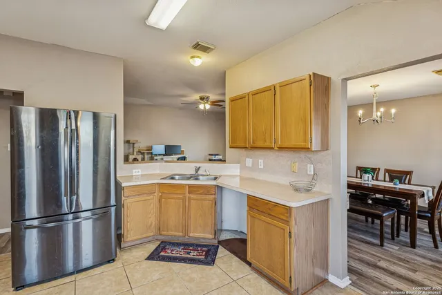 a kitchen with a sink a counter top space and appliances