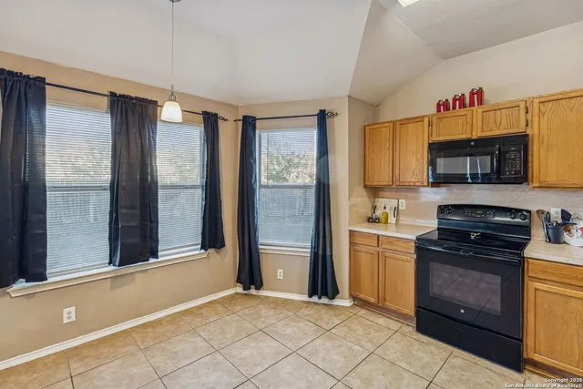 a kitchen with a refrigerator stove and a sink