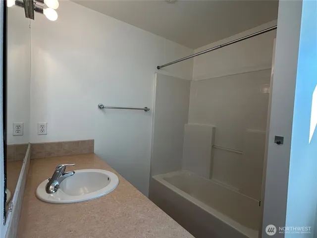 a bathroom with a sink and a tub