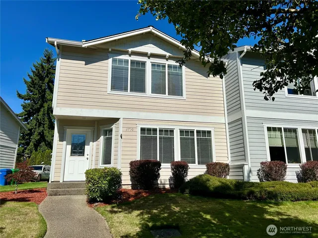 a view of an house with backyard space and garden