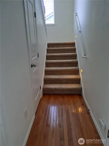 a view of entryway with wooden floor
