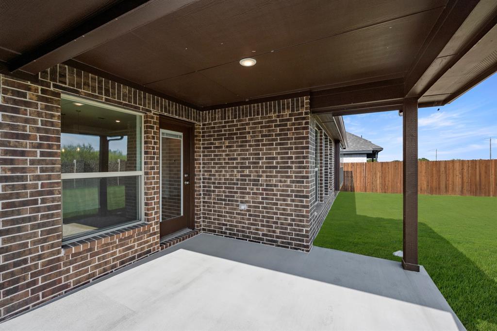 10809 Rothland Street Crowley, TX 76036 - Photo 24 of 30 a view of a backyard with a garden