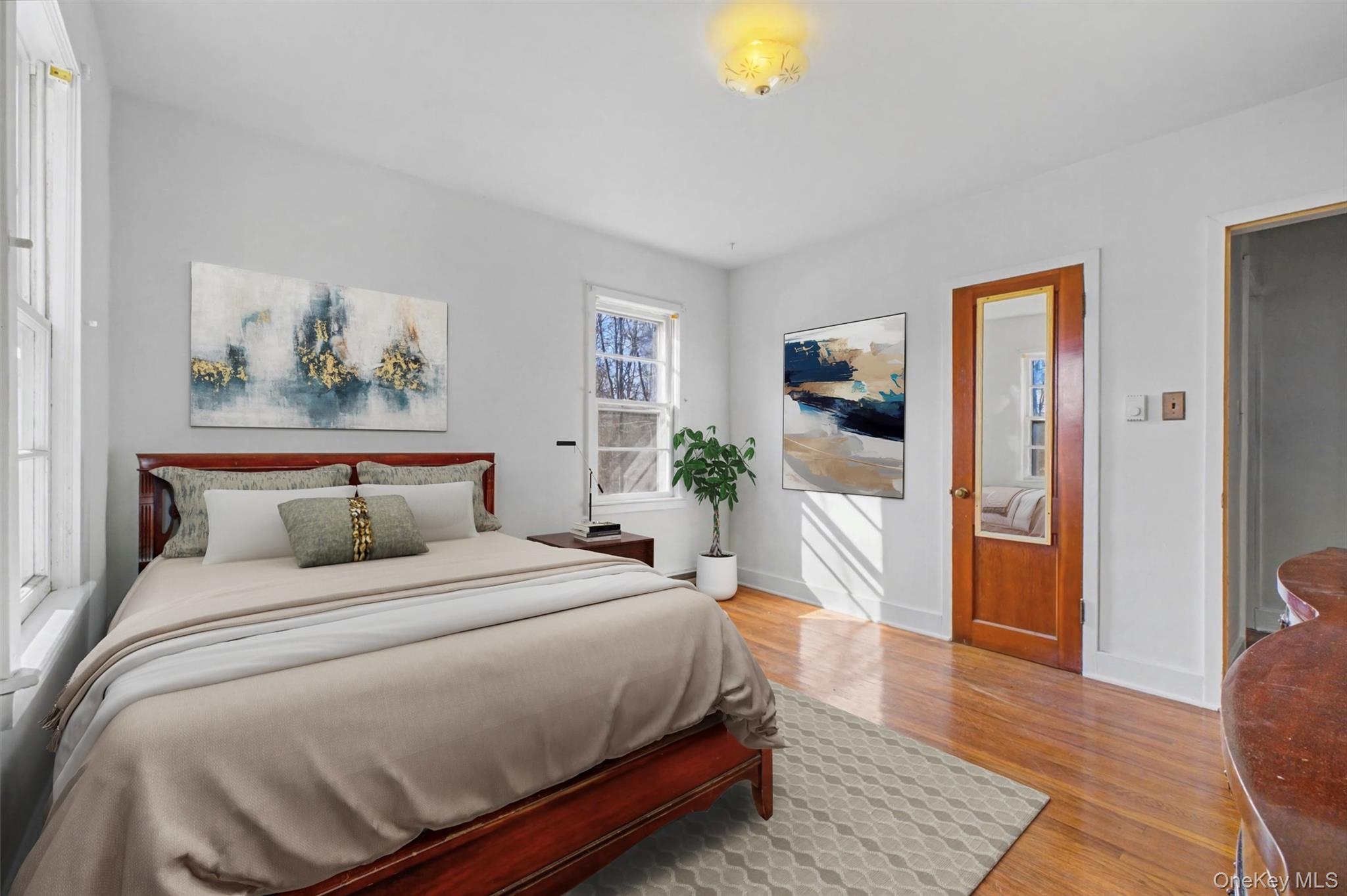 566 Old State Road Wappingers Falls, NY 12590 - Photo 11 of 19 Virtually Staged. Comfortable bedroom with neutral tones and natural light, offering flexible use as a guest room or home office.