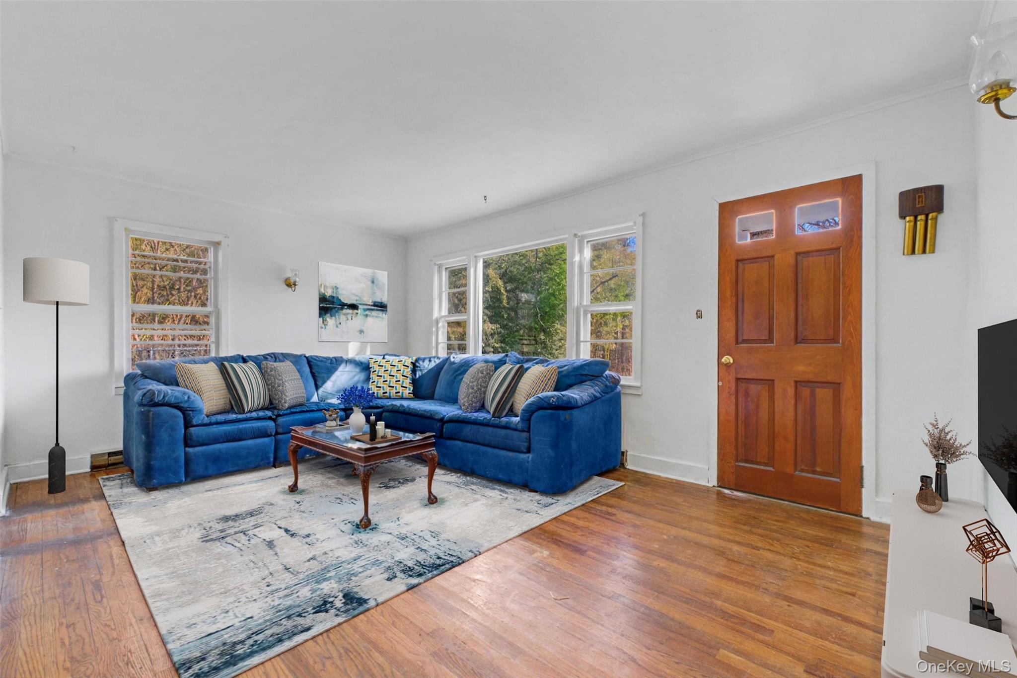 566 Old State Road Wappingers Falls, NY 12590 - Photo 5 of 19 Virtually Staged Bright and inviting living room offering generous seating space and a comfortable layout for relaxing or entertaining.