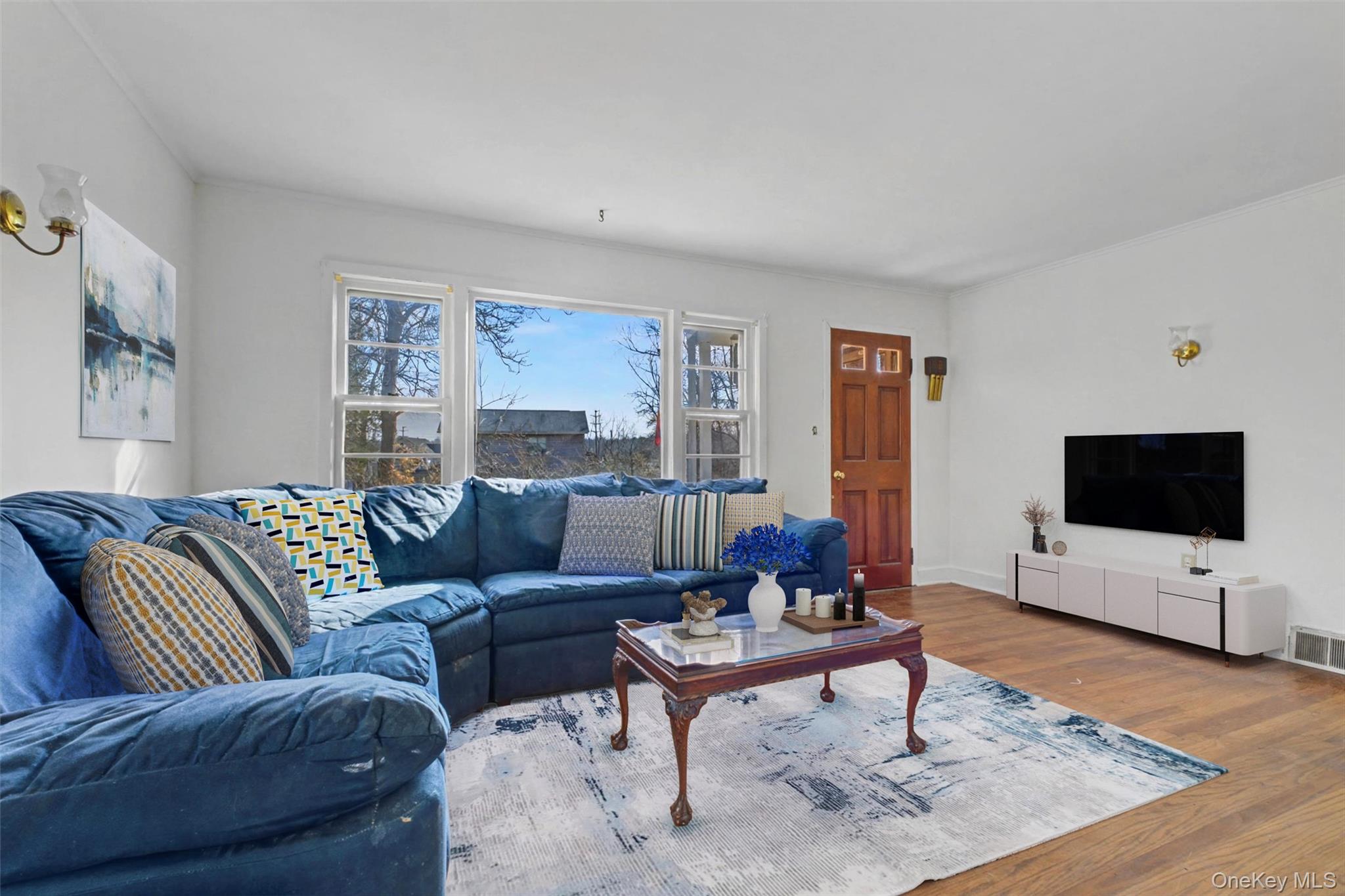 566 Old State Road Wappingers Falls, NY 12590 - Photo 6 of 19 Virtually Staged Spacious living room featuring hardwood floors and large windows that fill the space with natural light.