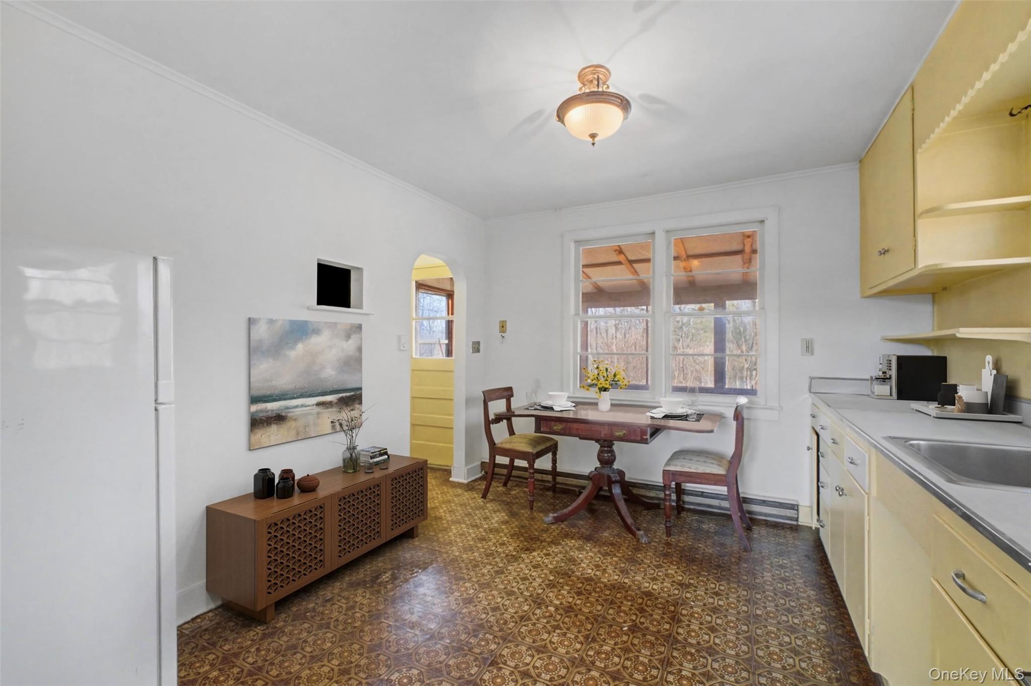 566 Old State Road Wappingers Falls, NY 12590 - Photo 7 of 19 Inviting eat-in kitchen with windows overlooking the yard, offering a bright setting for dining.