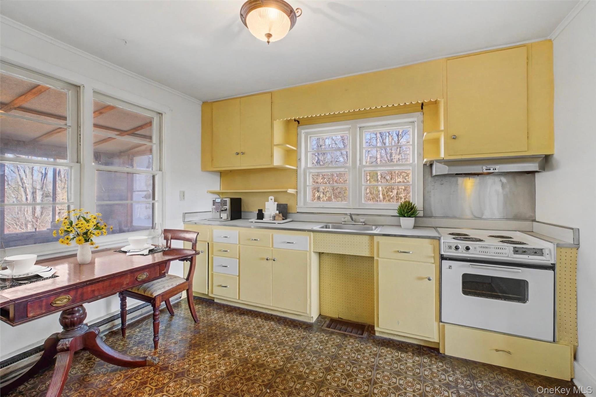 566 Old State Road Wappingers Falls, NY 12590 - Photo 8 of 19 Bright kitchen featuring ample cabinetry, generous counter space, and natural light from multiple windows.