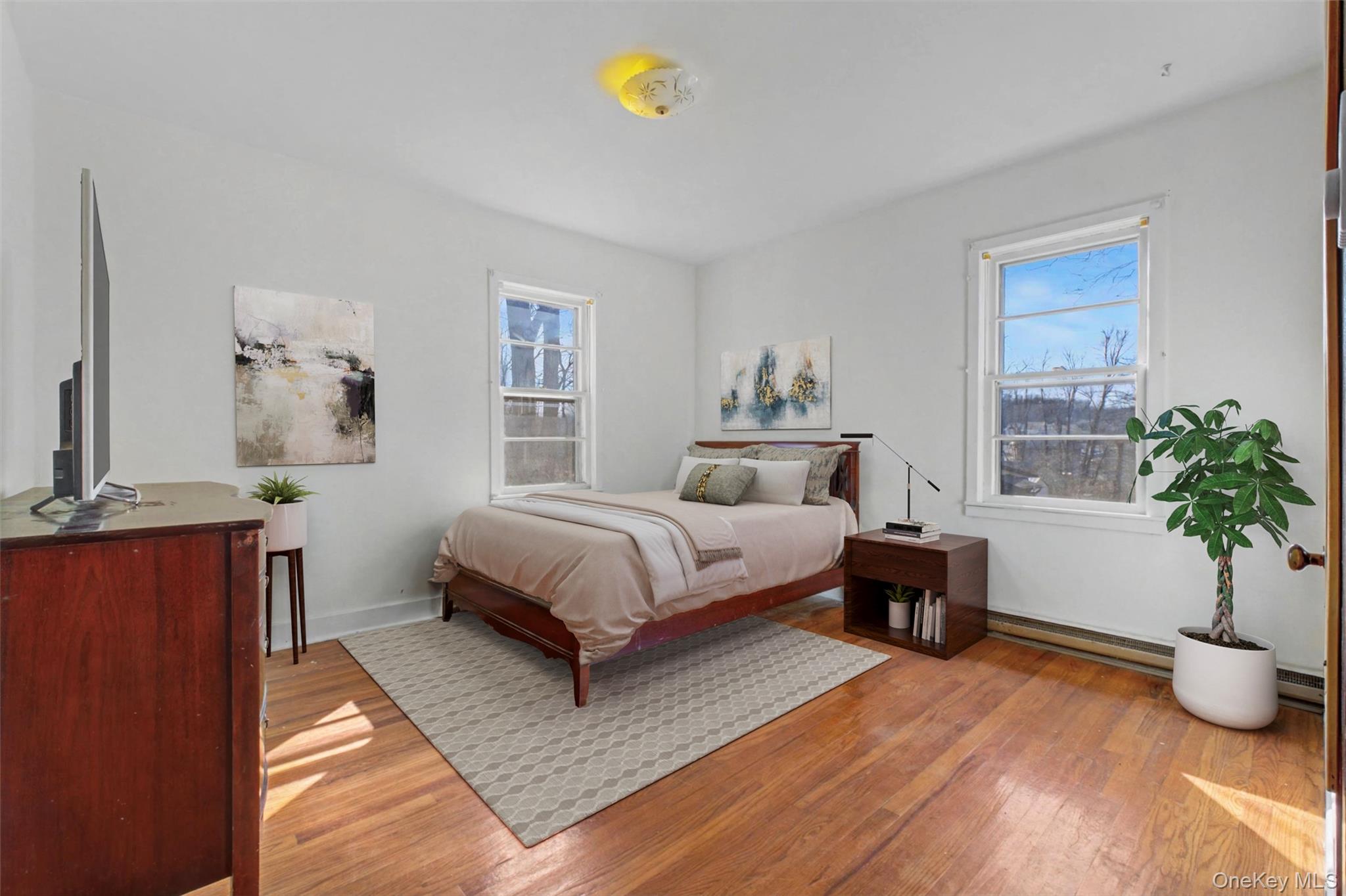 566 Old State Road Wappingers Falls, NY 12590 - Photo 10 of 19 Virtually Staged. Inviting bedroom with classic hardwood flooring and windows providing natural light throughout the day.