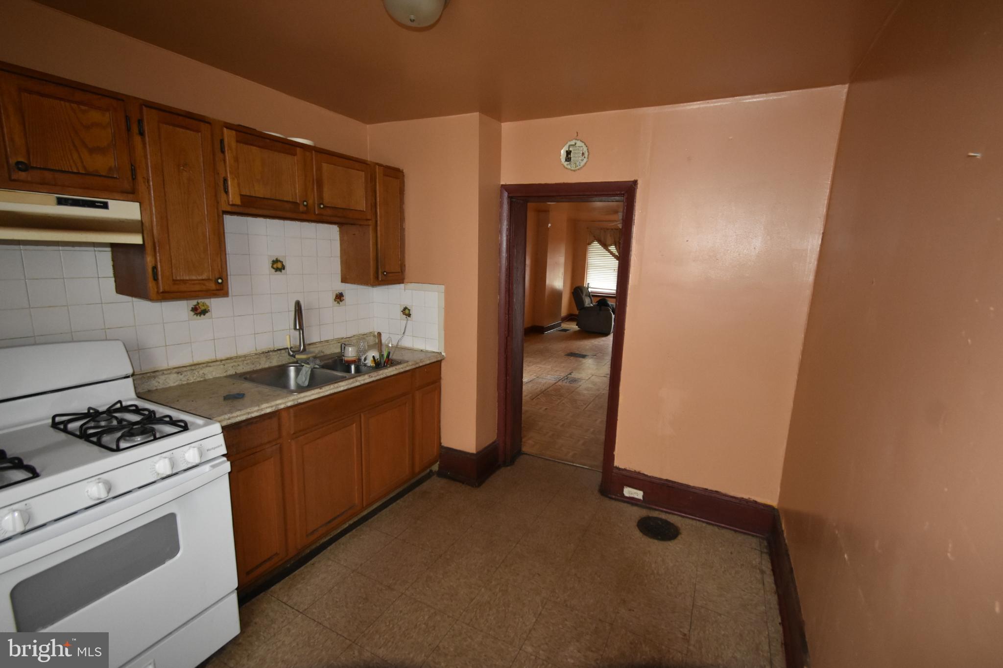 1653 Cadwallader Street Philadelphia, PA 19122 - Photo 11 of 34 a kitchen with a refrigerator and a stove