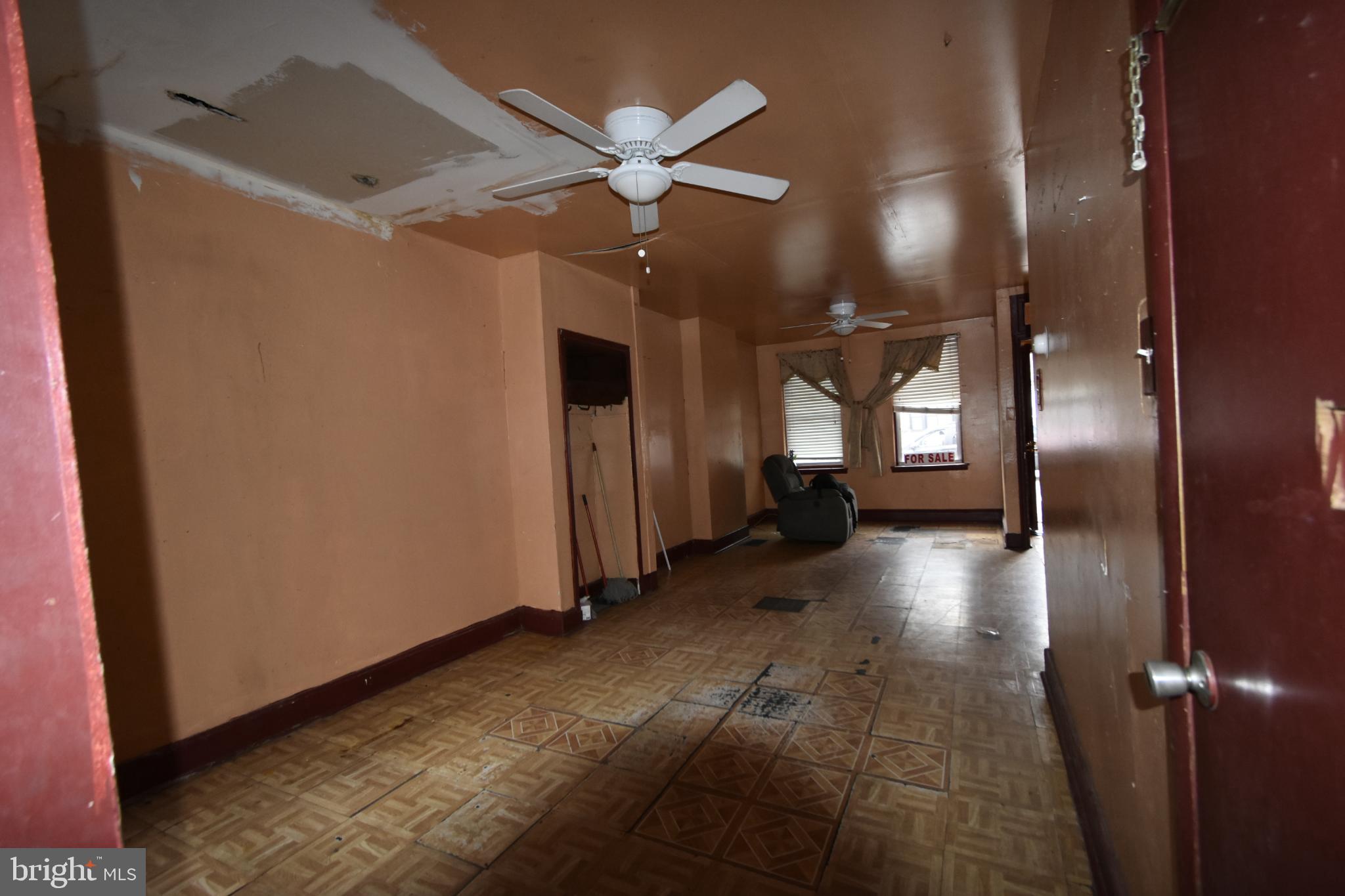 1653 Cadwallader Street Philadelphia, PA 19122 - Photo 16 of 34 a view of a livingroom with a ceiling fan and window