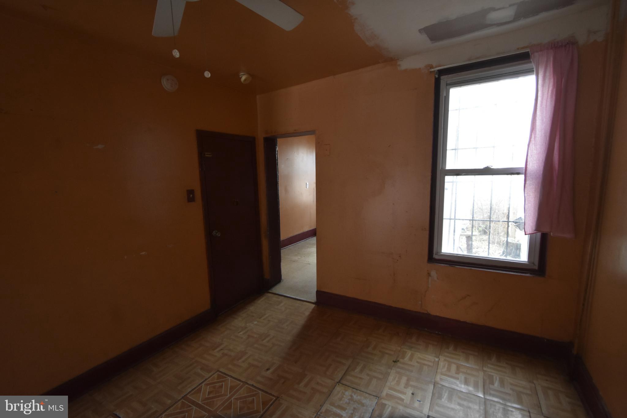 1653 Cadwallader Street Philadelphia, PA 19122 - Photo 9 of 34 a view of an empty room with a window