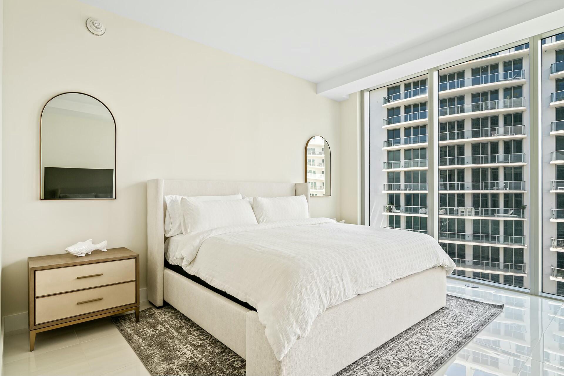 3100 North Ocean Drive, Unit H1409 Singer Island, FL 33404 - Photo 17 of 31 a bedroom with a bed and a window