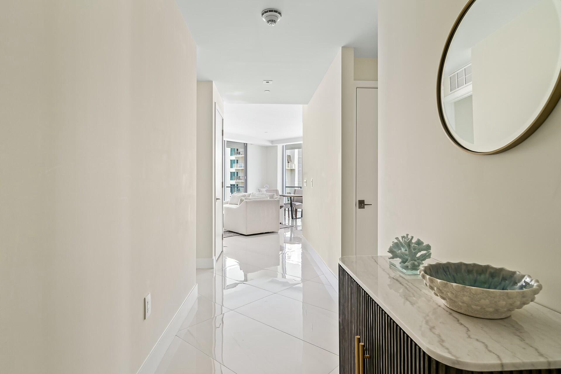 3100 North Ocean Drive, Unit H1409 Singer Island, FL 33404 - Photo 26 of 31 a bathroom with a granite countertop sink and a mirror