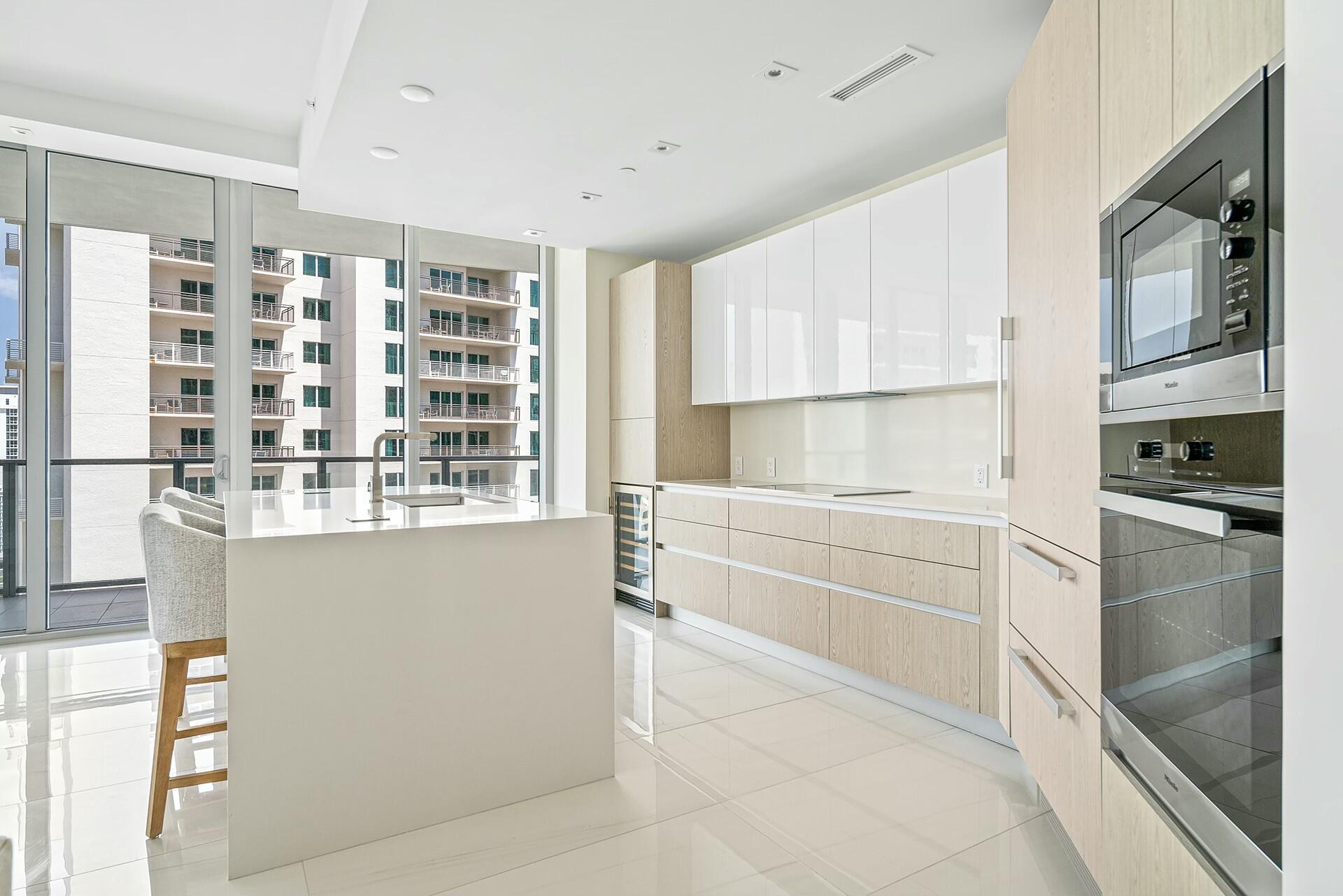 3100 North Ocean Drive, Unit H1409 Singer Island, FL 33404 - Photo 6 of 31 a kitchen with a refrigerator oven and a sink