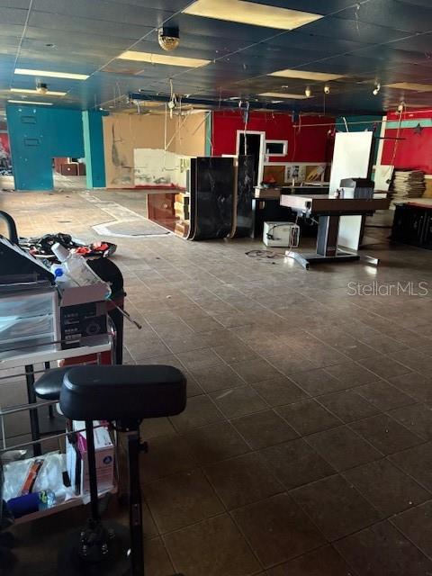 4560 Commercial Way Spring Hill, FL 34606 - Photo 7 of 15 a room with furniture and a flat screen tv