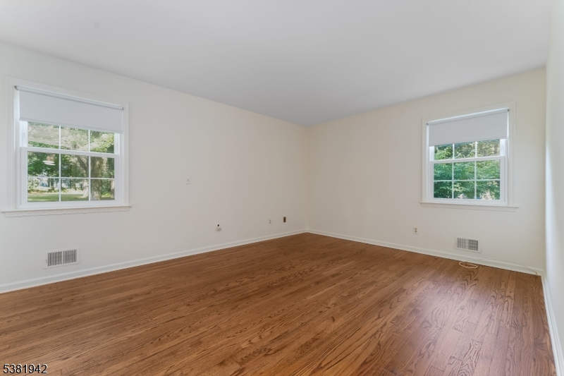 478 Charlestown Road Hampton, NJ 08827 - Photo 13 of 44 a view of an empty room with wooden floor and a window