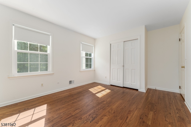 478 Charlestown Road Hampton, NJ 08827 - Photo 15 of 44 an empty room with wooden floor and windows