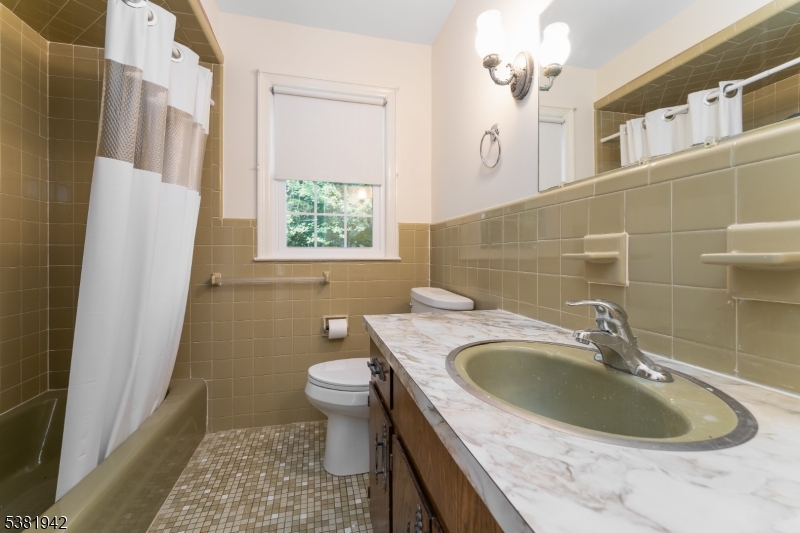 478 Charlestown Road Hampton, NJ 08827 - Photo 17 of 44 a bathroom with a sink a toilet and a mirror