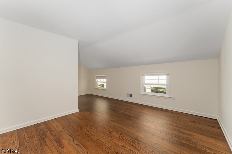 478 Charlestown Road Hampton, NJ 08827 - Photo 19 of 44 an empty room with wooden floor and windows