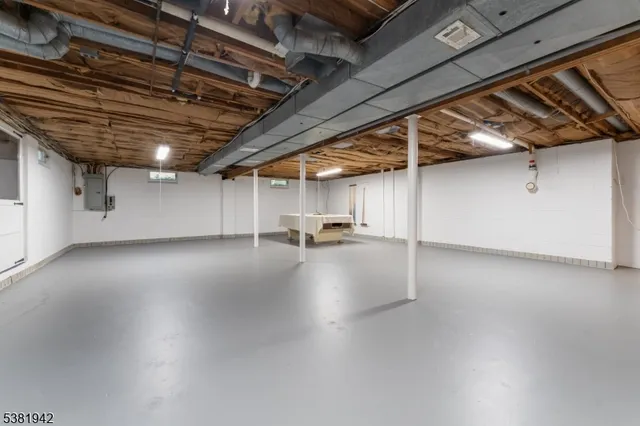a view of empty room with wooden ceiling