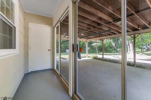a view of a glass door of the house