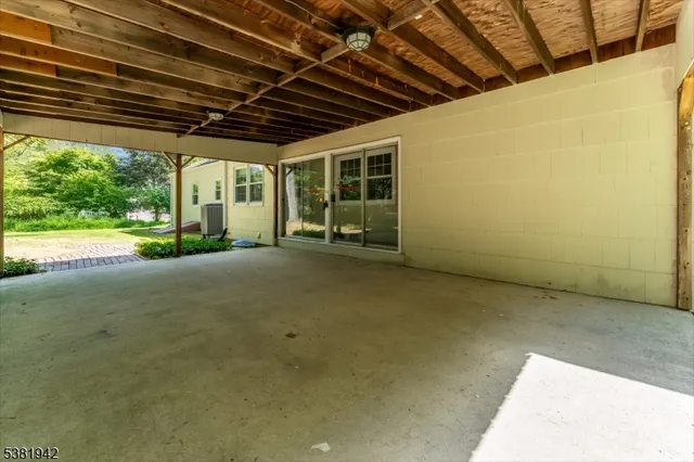 a view of a house with backyard and porch