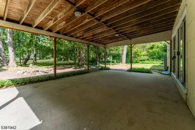 a view of a room with wooden walls