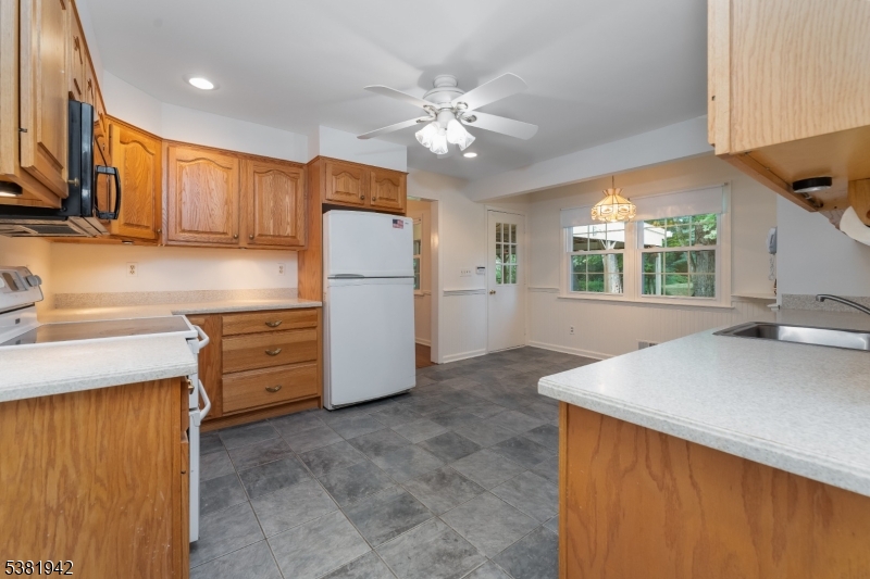 478 Charlestown Road Hampton, NJ 08827 - Photo 8 of 44 a kitchen with furniture a refrigerator and a sink