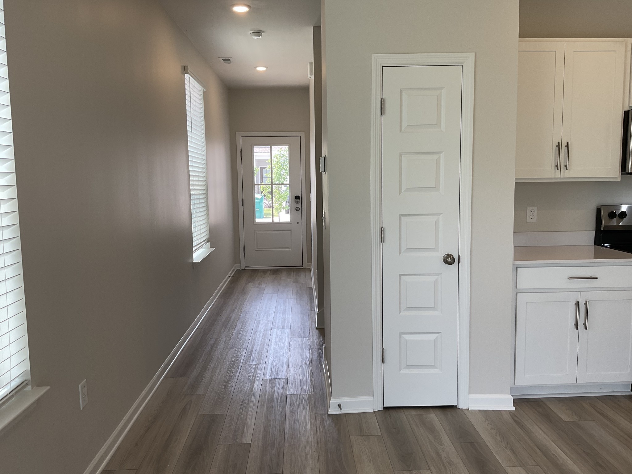 1056 Legacy Court Smyrna, TN 37167 - Photo 3 of 16 a view of a hallway with wooden floor and a bathroom