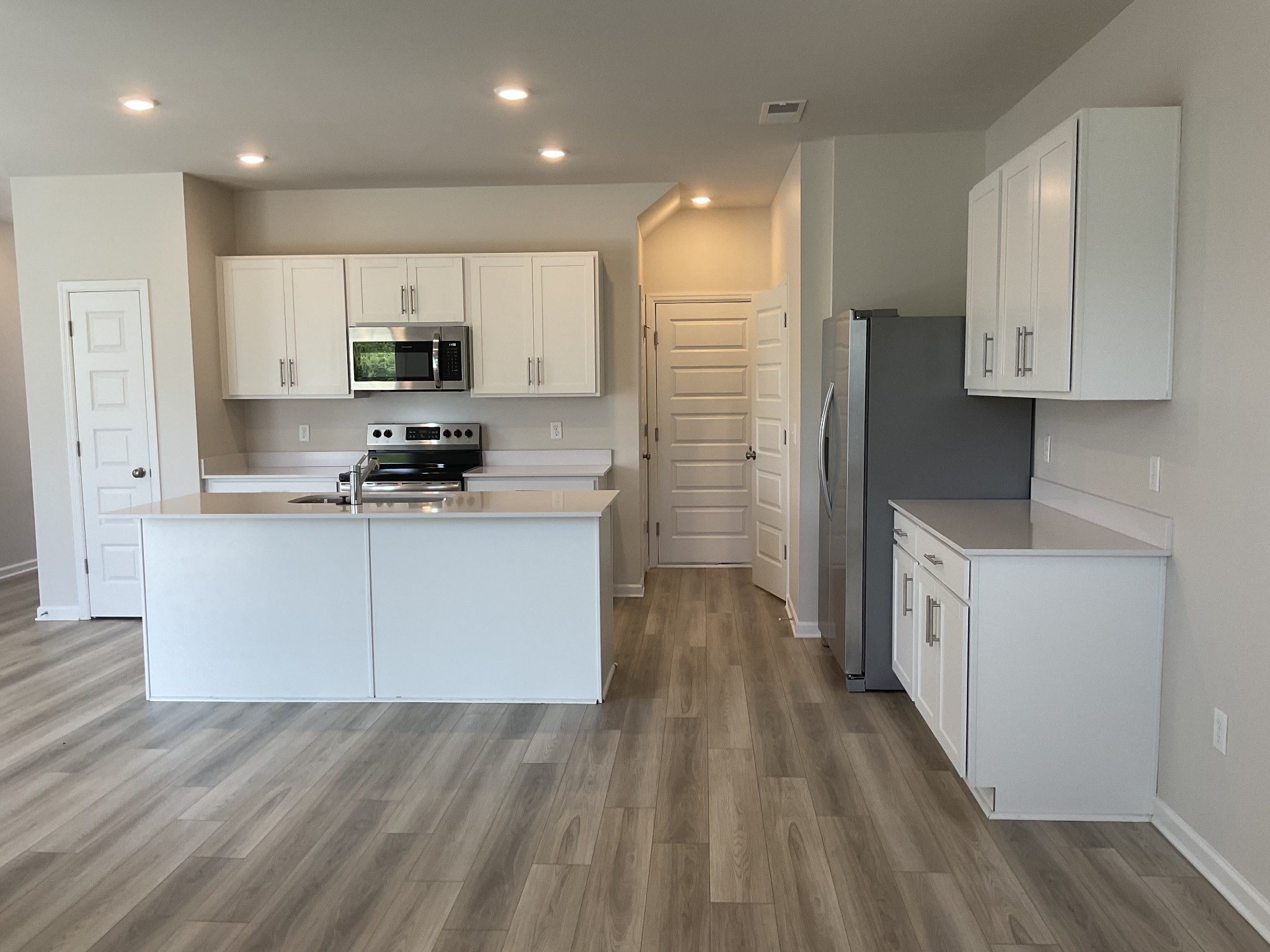 1056 Legacy Court Smyrna, TN 37167 - Photo 5 of 16 a kitchen with stainless steel appliances a refrigerator sink and cabinets