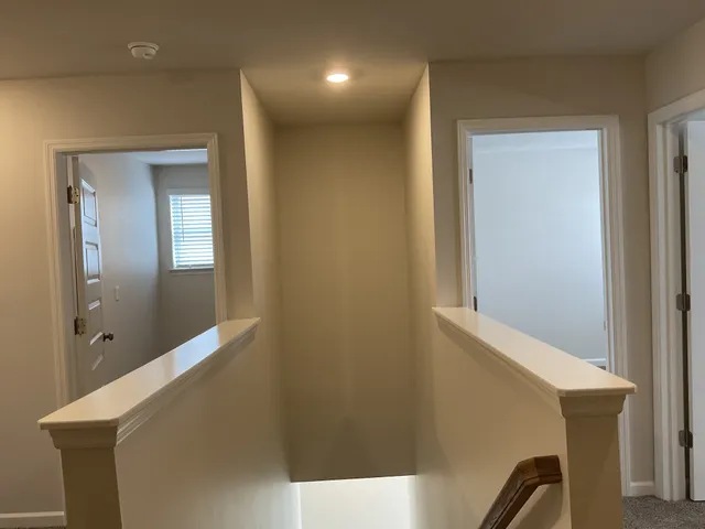 a view of hallway with mirror