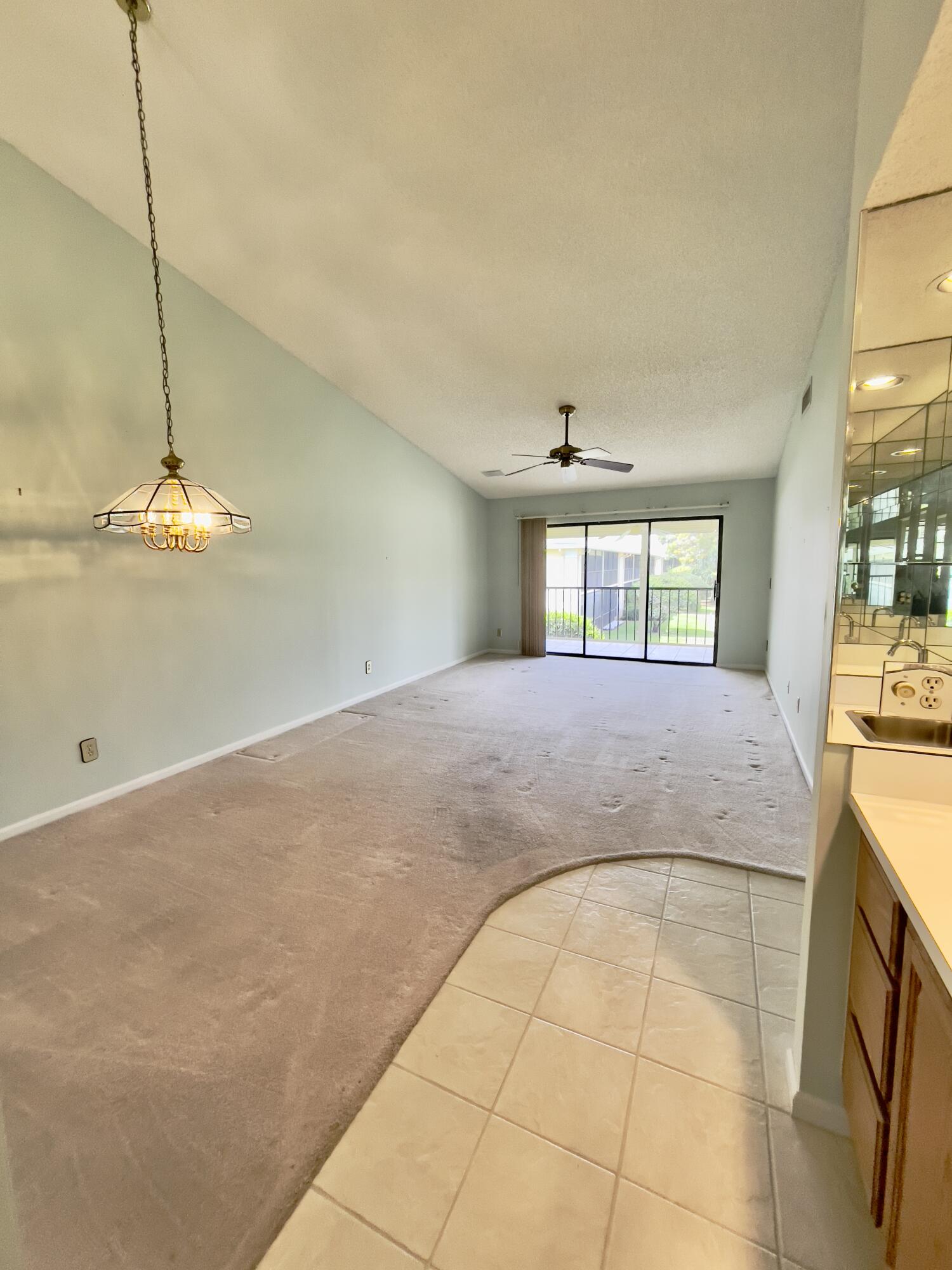 1002 Keystone Drive, Unit B Jupiter, FL 33458 - Photo 10 of 28 Vaulted ceiling in living & dining area