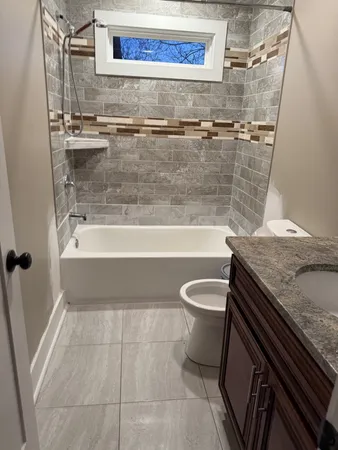 a view of walk in closet with wooden floor