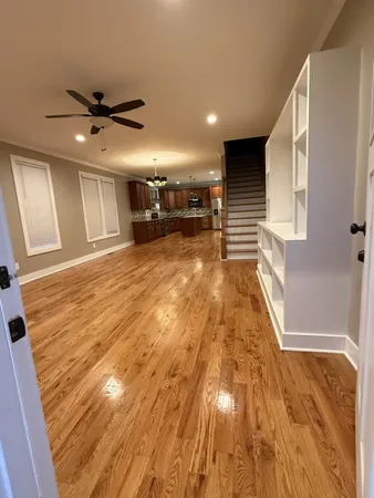 a view of a livingroom with kitchen and the sink