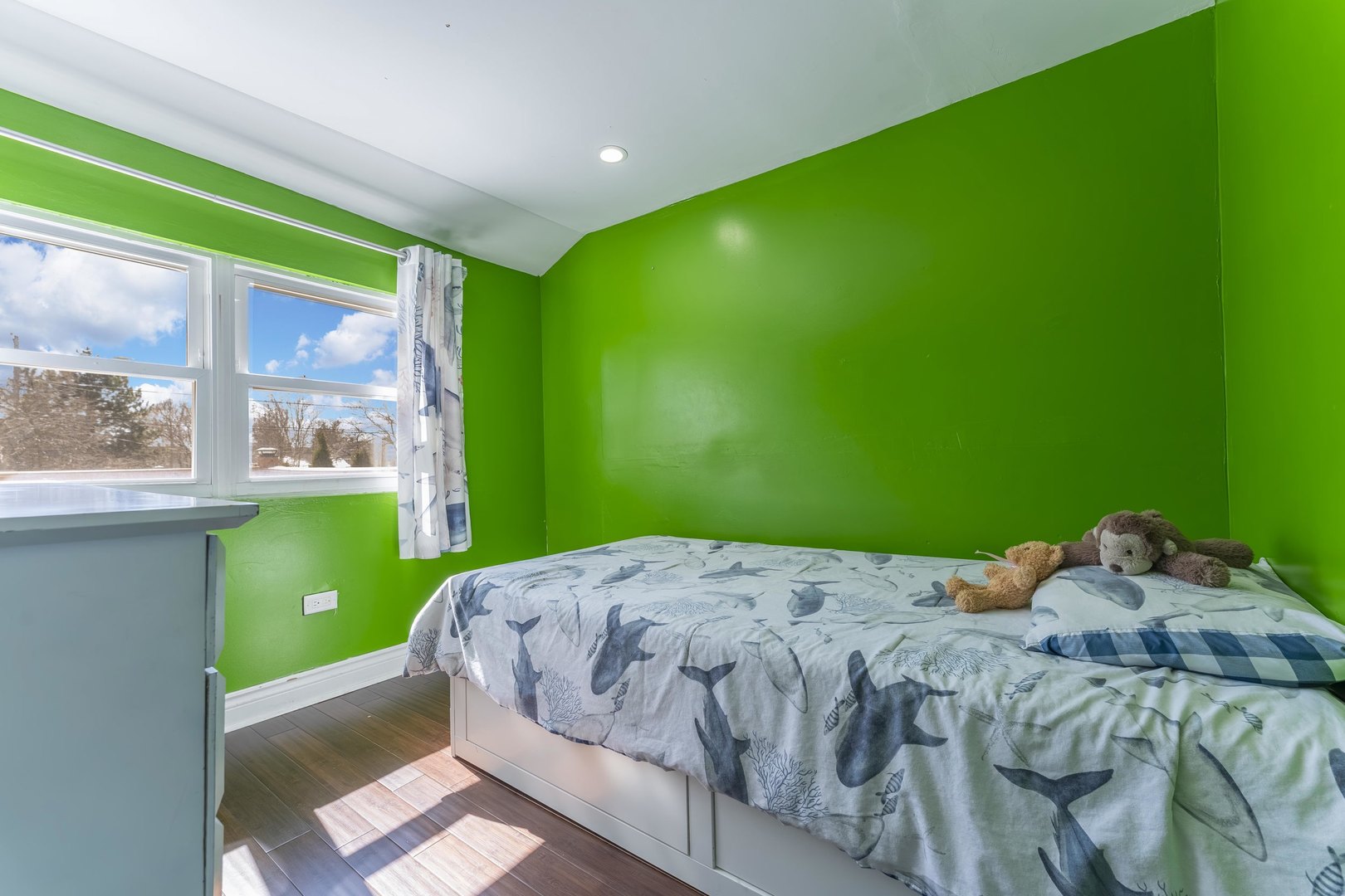 7731 45th Place Lyons, IL 60534 - Photo 13 of 21 a bed sitting in a bedroom next to a window