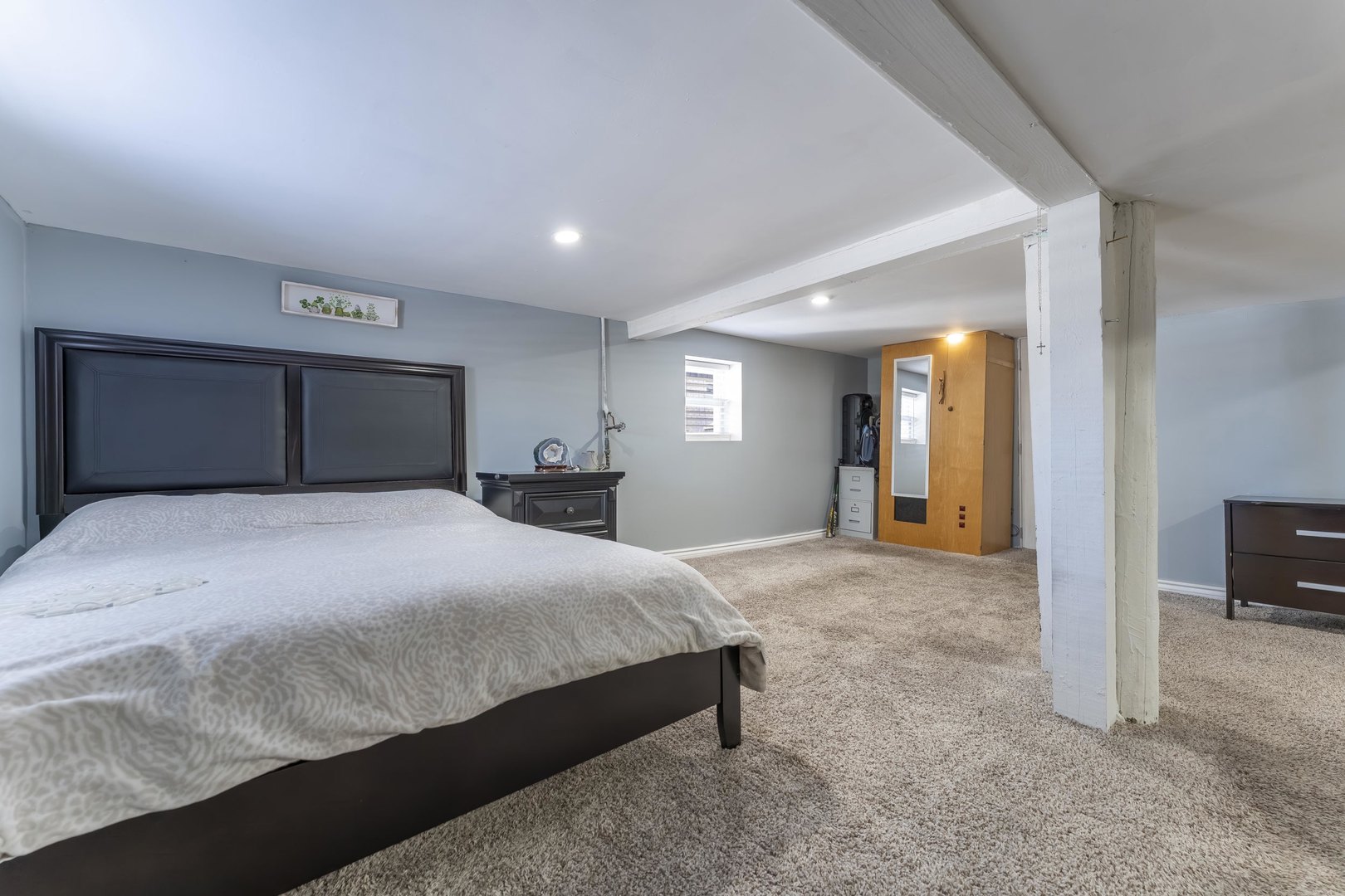 7731 45th Place Lyons, IL 60534 - Photo 18 of 21 a bedroom with a large bed and a view of bathroom