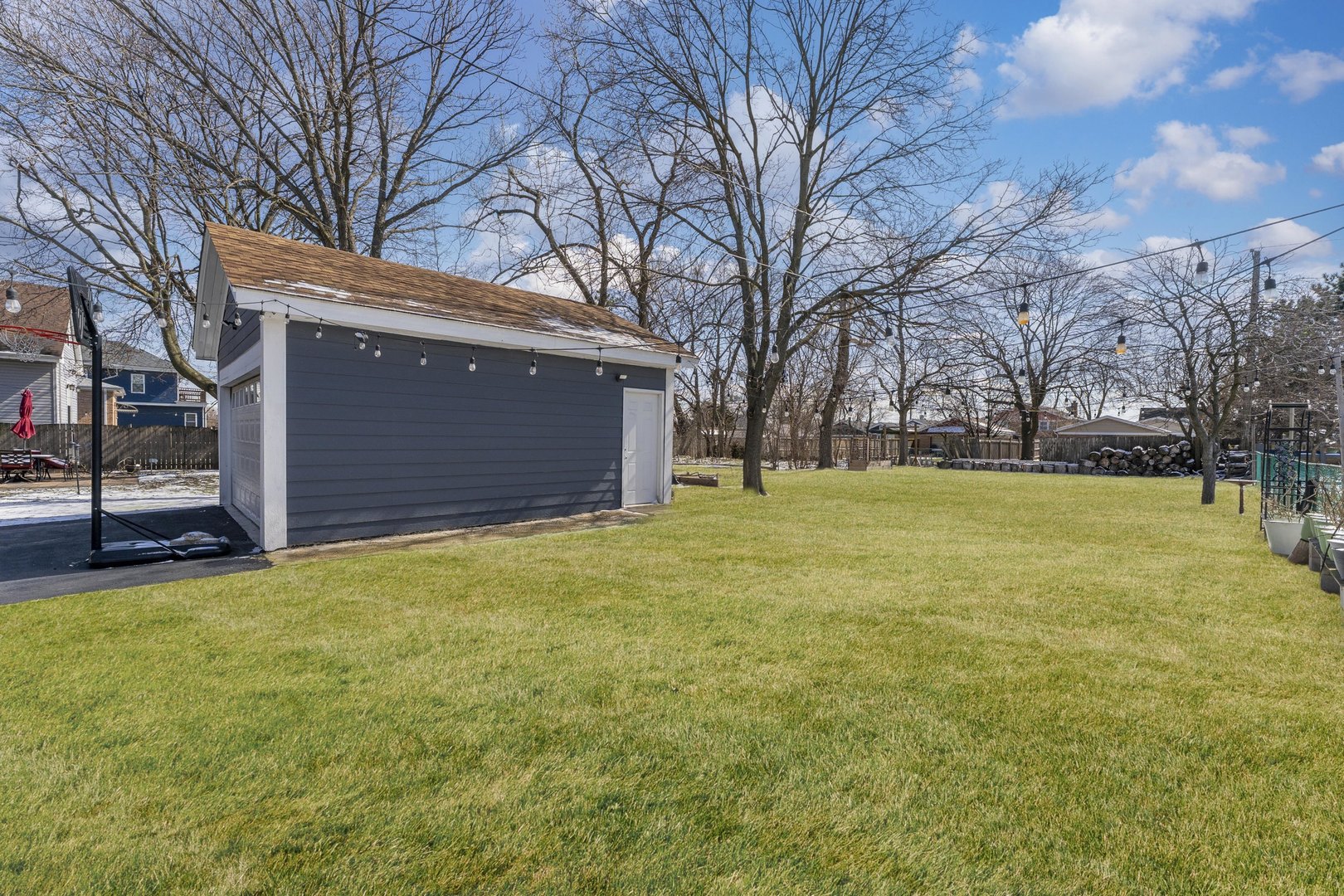 7731 45th Place Lyons, IL 60534 - Photo 20 of 21 a view of a house with a yard and garage