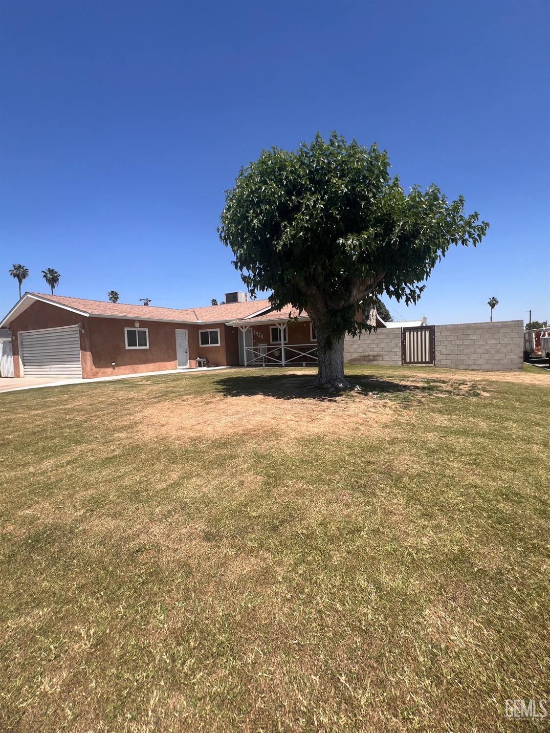 Undisclosed Address Bakersfield, CA 93304 - Photo 2 of 15 a view of a large pool with an outdoor space
