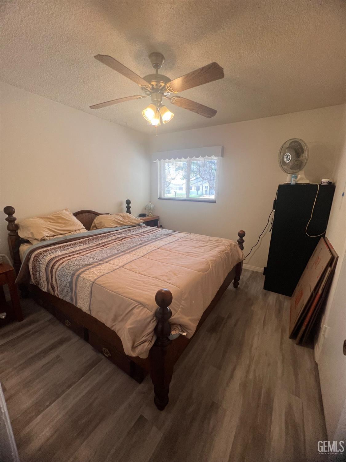 Undisclosed Address Bakersfield, CA 93304 - Photo 6 of 15 a bedroom with bed and window