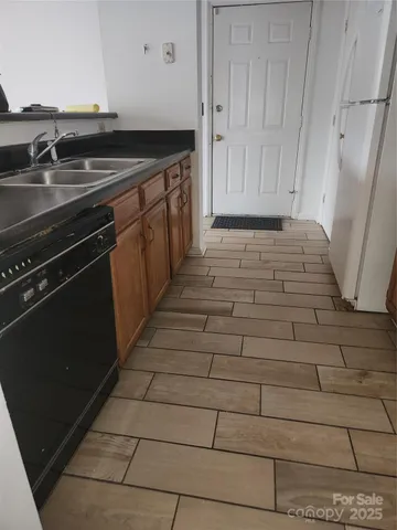 a bedroom with bed and a couch