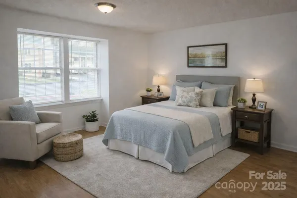 a view of a room with wooden floor and windows