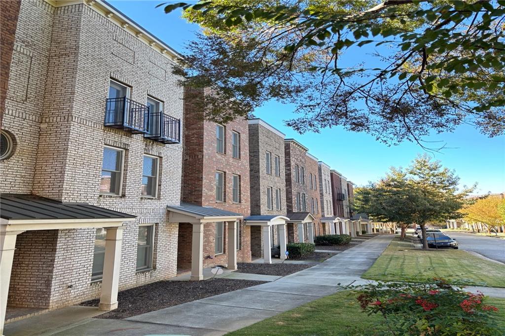 a view of multiple house with yard