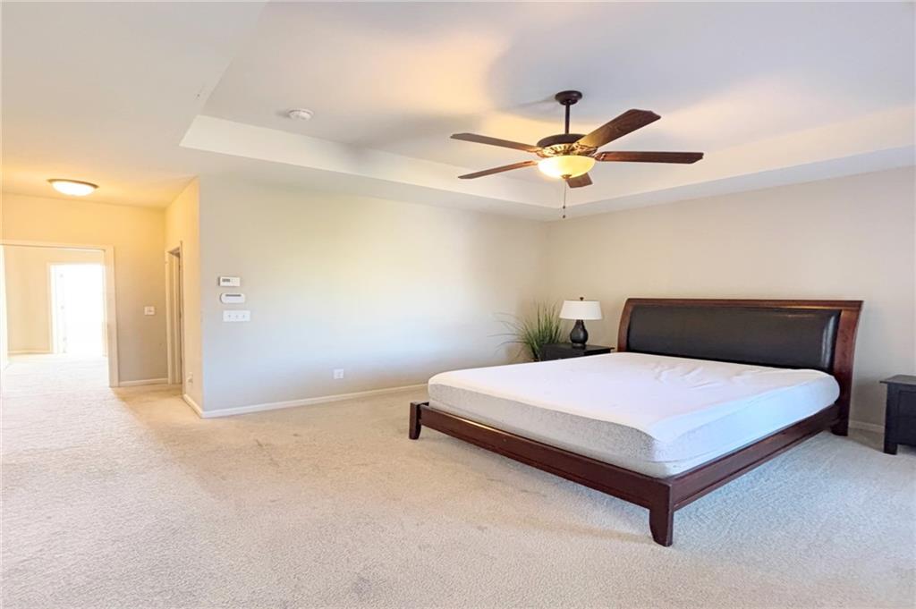772 Liberty Commons Drive Northwest Atlanta, GA 30314 - Photo 12 of 23 a bedroom with a bed and a ceiling fan