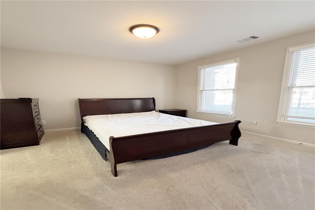 772 Liberty Commons Drive Northwest Atlanta, GA 30314 - Photo 16 of 23 a bedroom with a bed and window