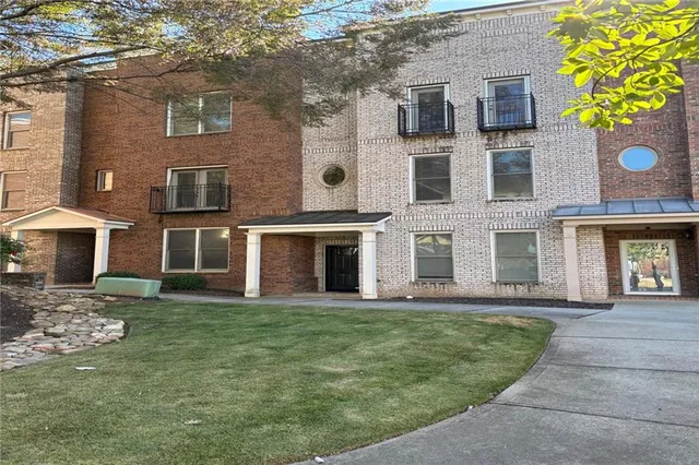 a view of a building with a garden