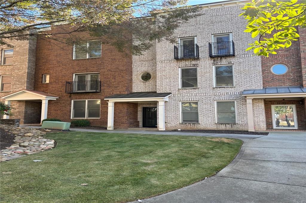 772 Liberty Commons Drive Northwest Atlanta, GA 30314 - Photo 2 of 23 a view of a building with a garden